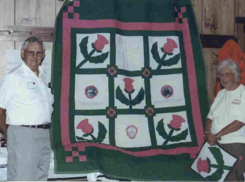 Fred & Gloria being given the thistle quilt